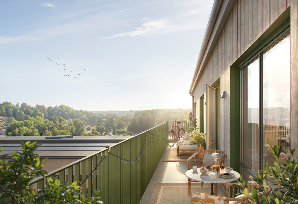 Visionsbild på rymlig balkong med utemöbler, växter och solig utsikt över natur och tak